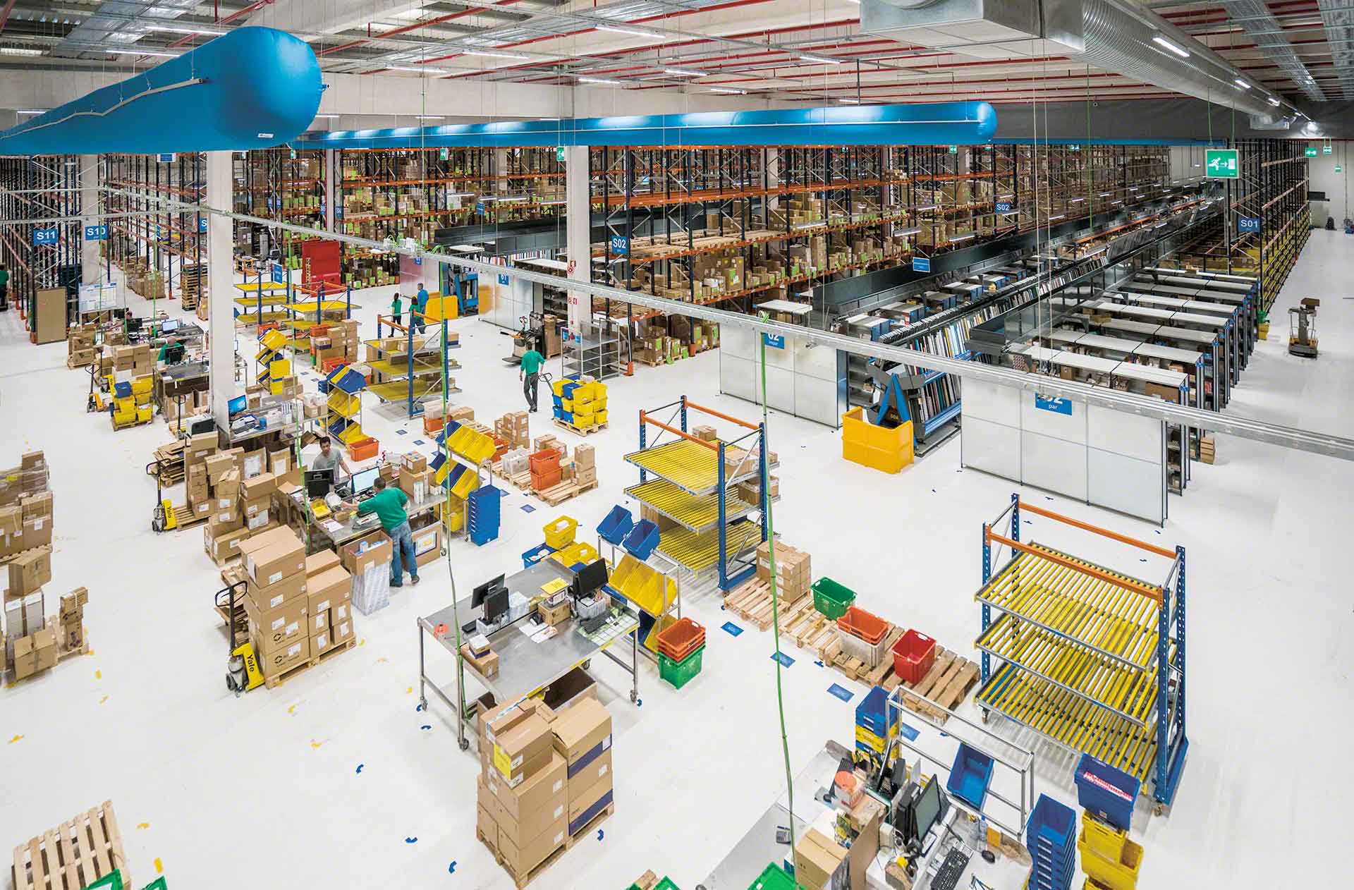 Operators perform product picking and packing tasks in the warehouse